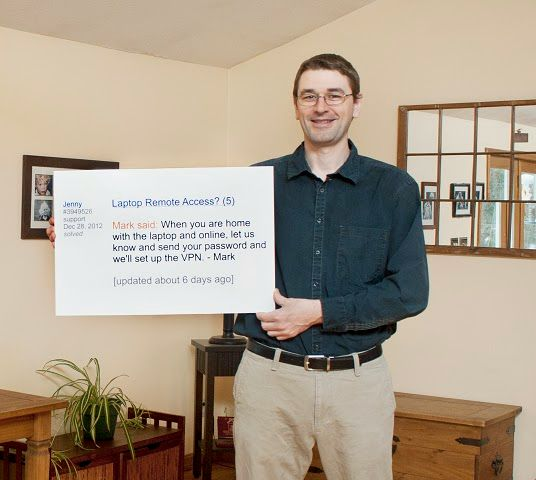 Mark Holding Sign